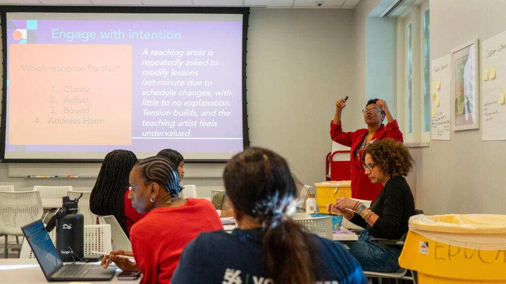 Photo of Ashley Cuthbertson facilitating a professional development workshop with arts educators.